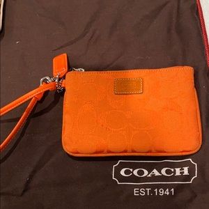 Coach orange monogram wristlet